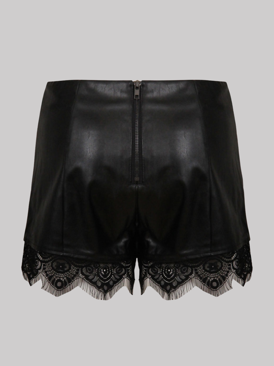 Ghost mannequin wears a  black faux leather shorts with panelled trim, a lace trim at the bottom of the shorts and an exposed zip back fastening. The ghost mannequin stands with her back to the camera, the back of the shorts can be seen, including the exposed zip fastening and the black lace trim at the bottom of the shorts.