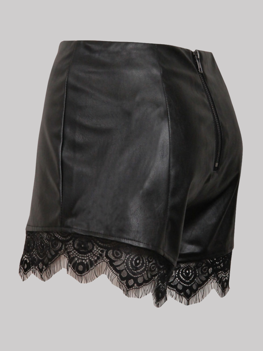 Ghost mannequin wears a  black faux leather shorts with panelled trim, a lace trim at the bottom of the shorts and an exposed zip back fastening. The ghost mannequin stands to the side, the side of the shorts can be seen, showing the panel trim design, the lace trim and the exposed zip fastening.