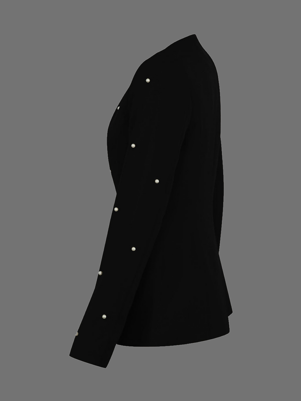 Ghost manequin wears a luxe black lapel-less blazer, with a tailored silhouette, front fastening and  decorative pearls accebrs  at the front of the blazer and blazer arms.  The ghost manequin stands to the side, the pearled sleeves can be seen which contrasts with the plain back, which can also be seen.