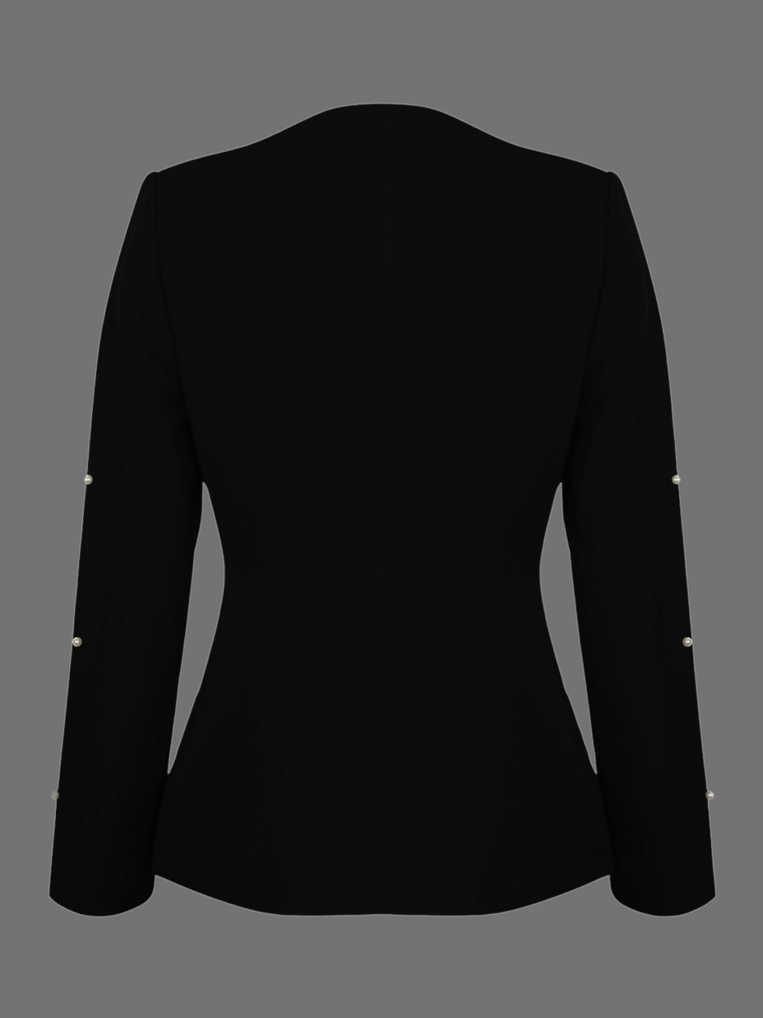 Ghost manequin wears a luxe black lapel-less blazer, with a tailored silhouette, front fastening and  decorative pearls accebrs  at the front of the blazer and blazer arms.  The ghost menquin stands to the side, the back of the blazer can be seen, demonstrating the plain back tailored silhouette design. The pearled sleeves are visible.