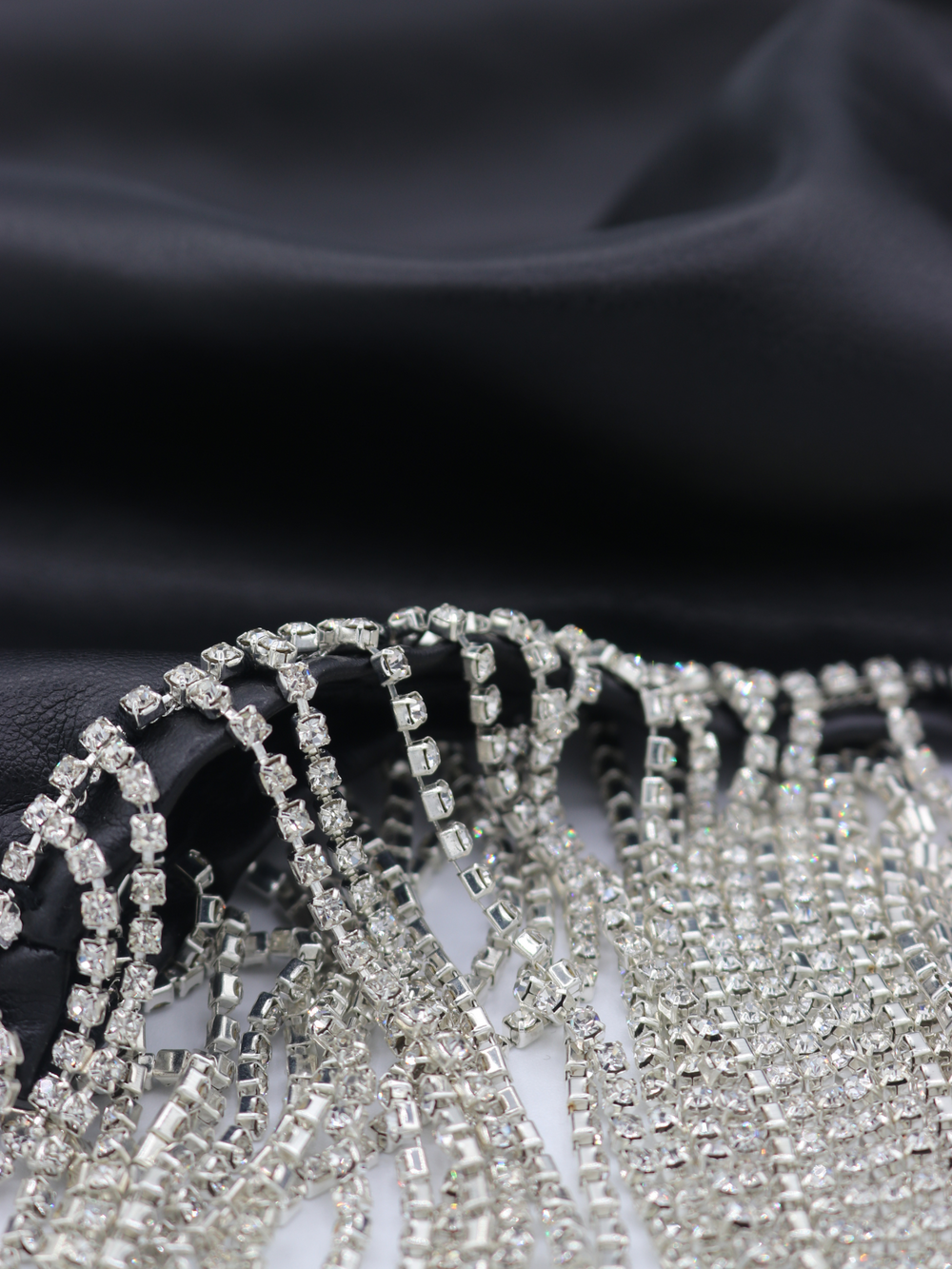 Close up of diamante strip that is attached to the faux leather  PU mini Skirt.
