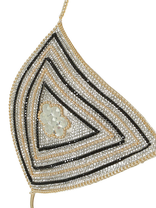 Ghost manequin wears gold a silver and black diamante bralette with gold chain halter neck chain hook fastening. The diamante bralette has triangle shaped cups, that has silver and gold jeweled design at the centre.  One side of the triangle design is visible.
