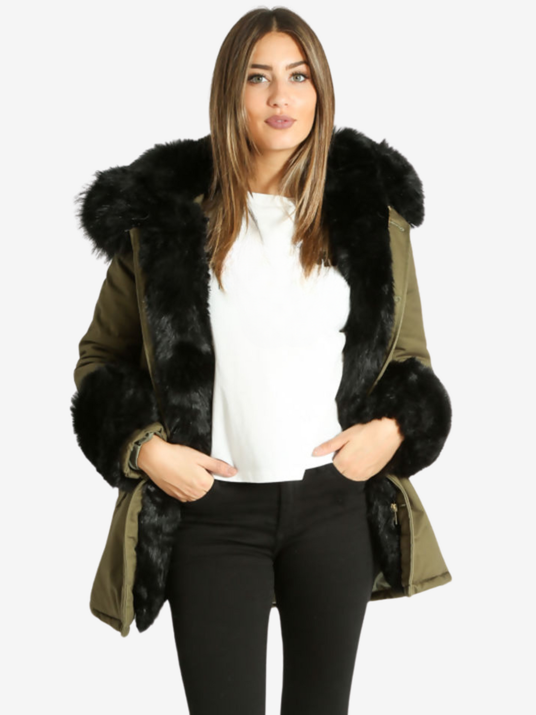 Mid length shot. Model wears a green khaki jacket with black faux fur cuffs, a hood with faux fur trim and detachable faux fur frontal flaps. Model stands with one leg slightly in front of the other.