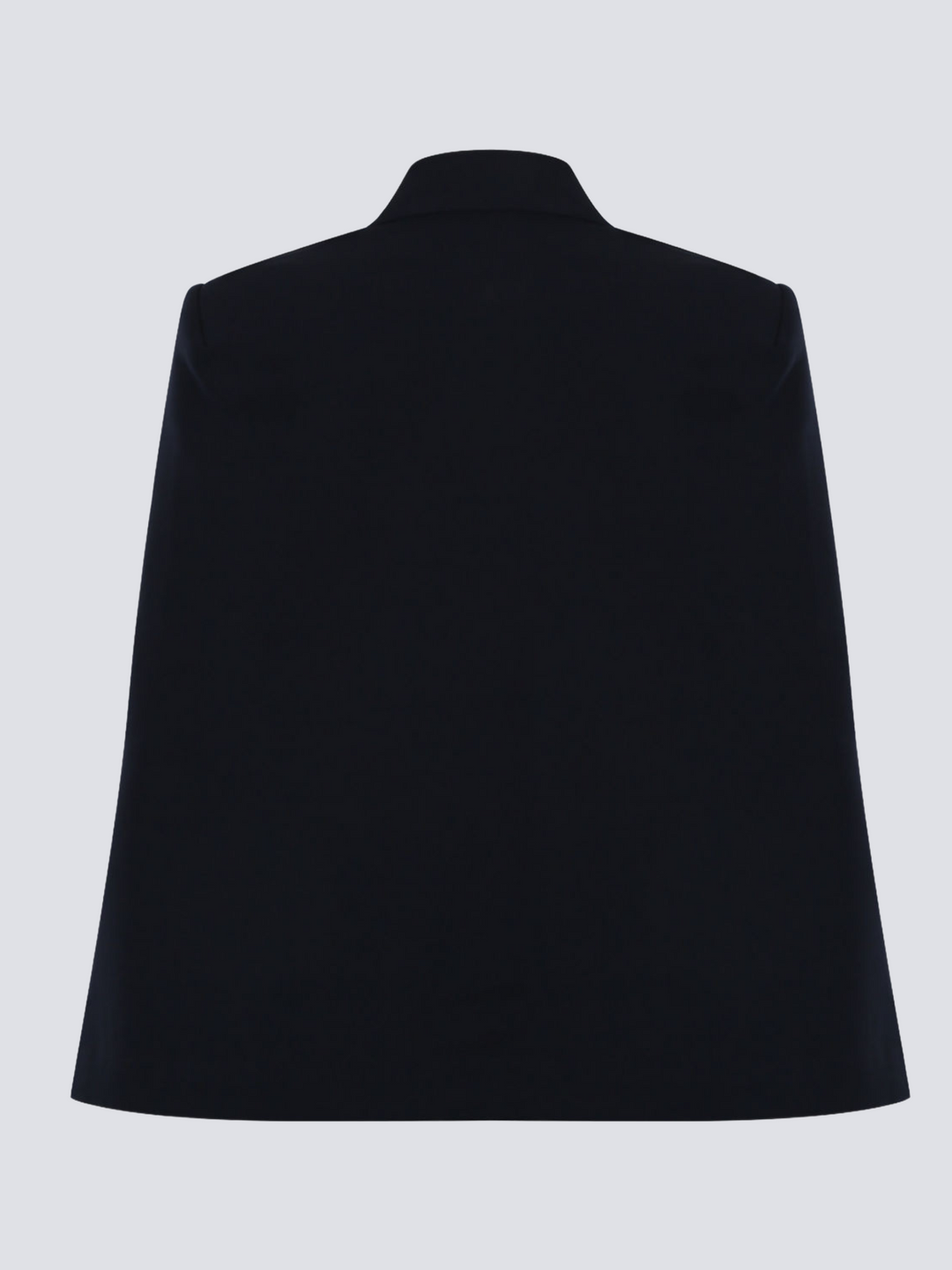 Ghost manequin wears a luxe navy blazeer with a double breasted design, cape sleeves and a gold military buttons at the front of the blazer.  The ghost manequin stands with its back towards the camera. The back of the navy blazer can be seen, demonstrating the cape shape.