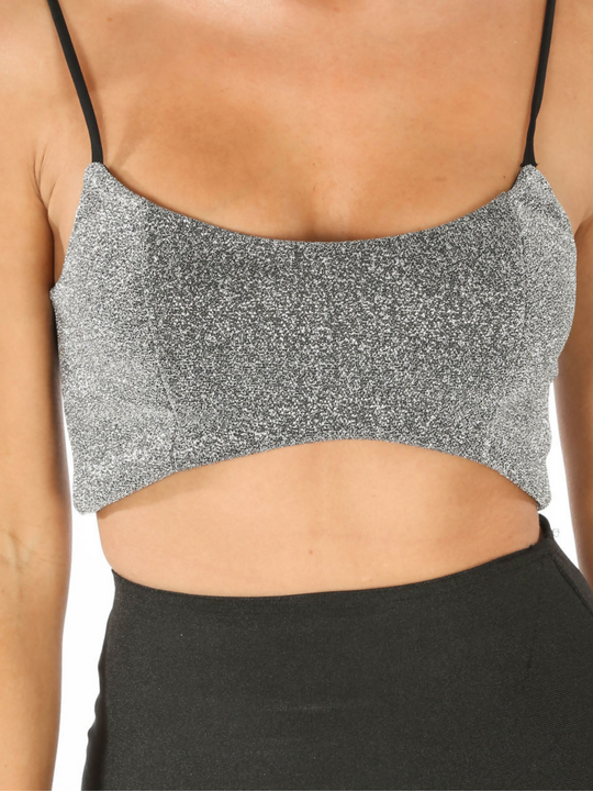 Close up of the bralette. Model wears silver lurex bralette with zip back fastening.