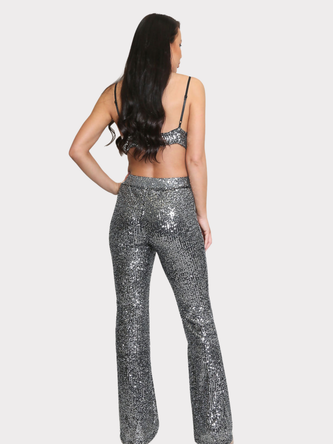 Full length shot. Model stands with her back to the camera, the back of the co-ord can be seen including the adjustable spaghetti straps.  Model stands with her back to the camera, the back of the co ord set can be seen, including the adjustable spaghetti straps.