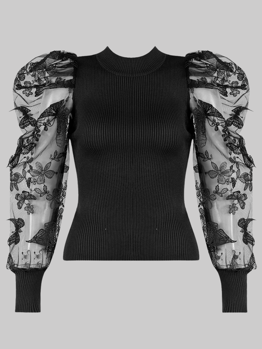 Ghost mannequin wears a black high neck jumper, with sheer sleeves and an embroidery crocheted design.  The ghost mannequin faces forward, the front pf the jumper can be seen.