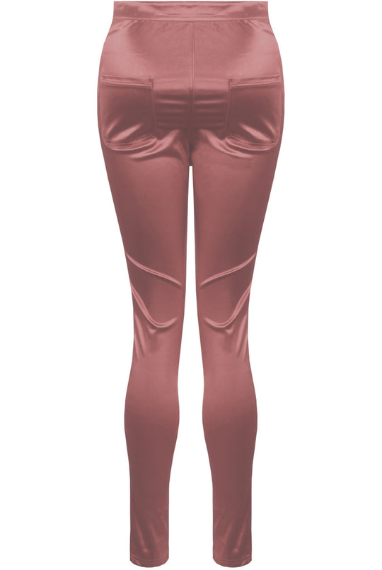 Ghost manequin wears a pink satin skinny fit trousers with front button closure. The Ghost manequin stands so that the back of the trousers and the back pockets is visible.
