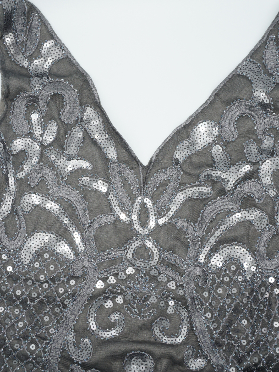 Closeup premium dress sequined grey maxi dress material.
