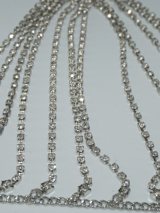 Close up of diamante links of the silver diamante bralette.