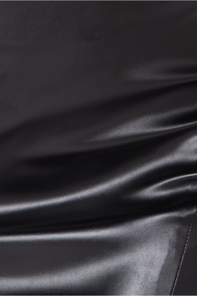 Close up of faux leather midi skirt with front side split.