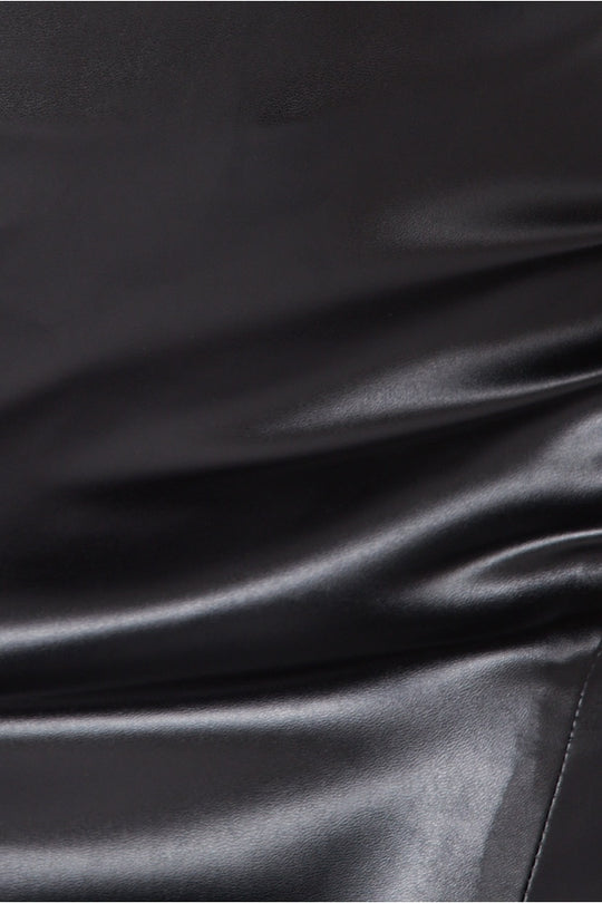 Close up of faux leather midi skirt with front side split.