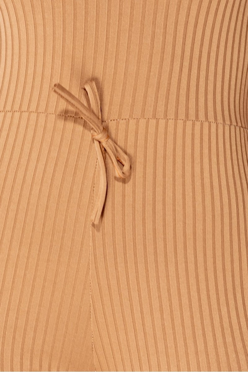 Close up of camel ribbed knit material