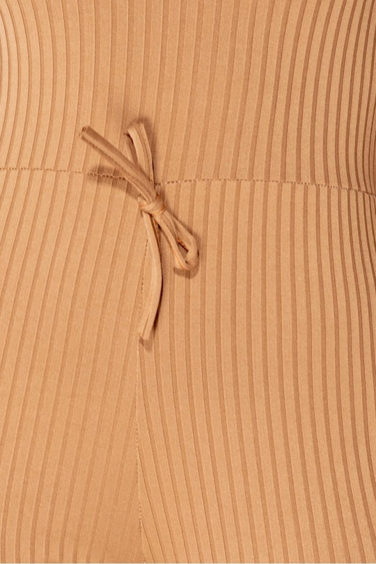 Close up of camel ribbed knit material