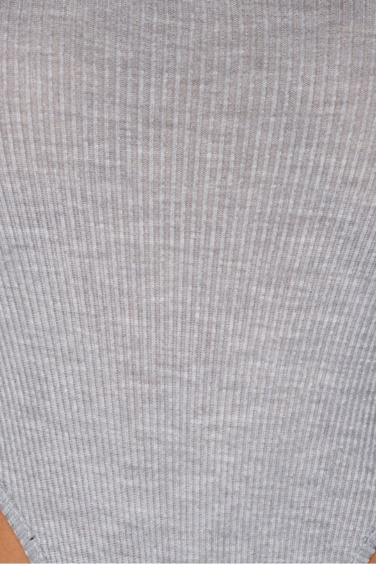 closeup of the grey ribbed material of the high legged grey bodysuit.