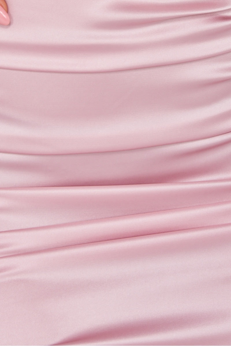 close up of pink ruched satin material.