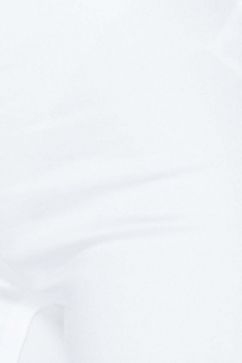 Closeup of white jeggings.