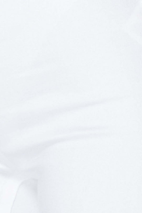 Closeup of white jeggings.