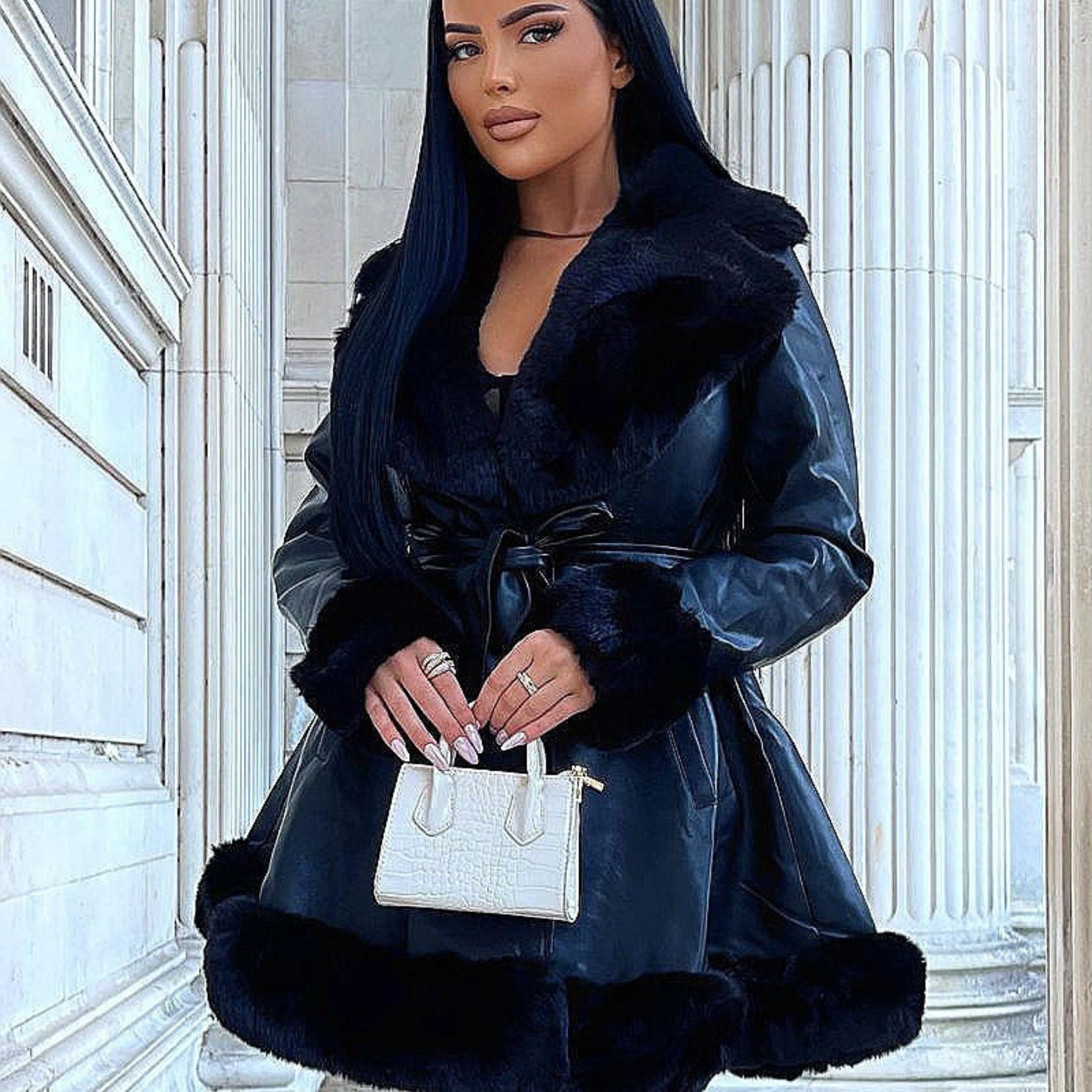 4ever Stunning Coats and Jackets Collection Tile. Model wears a black faux leather swing Coat with black faux fur trim.