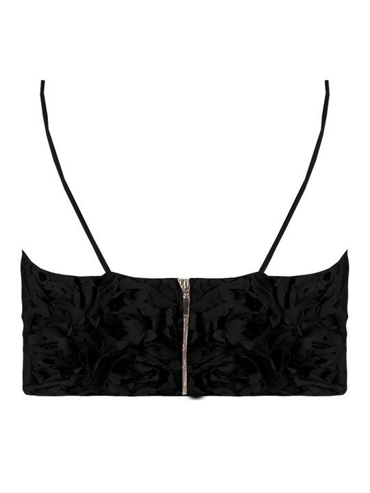 Ghost mannequin wears a black 3D rose design bralette, with a sweetheart neckline, exposed zip back fastening and spaghetti straps. The ghost mannequin stands with his back to the camera, the back of the rose can be seen, including the 3d rose design and zip back fastening. 