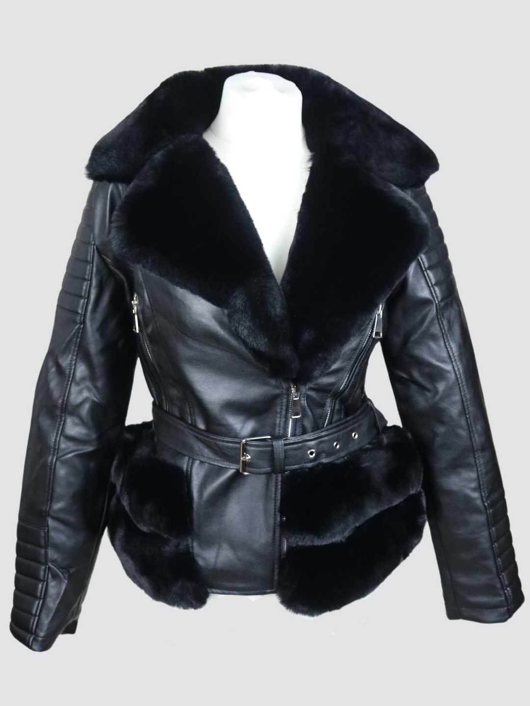 Ghost manequin wears a biker faux leather jacket with faux fur trim. The jacket has leather panelled detailing at the sleeves and exposed asymmetric chunky zip fastening. The faux leather jacket has a removable faux  belted waist. 