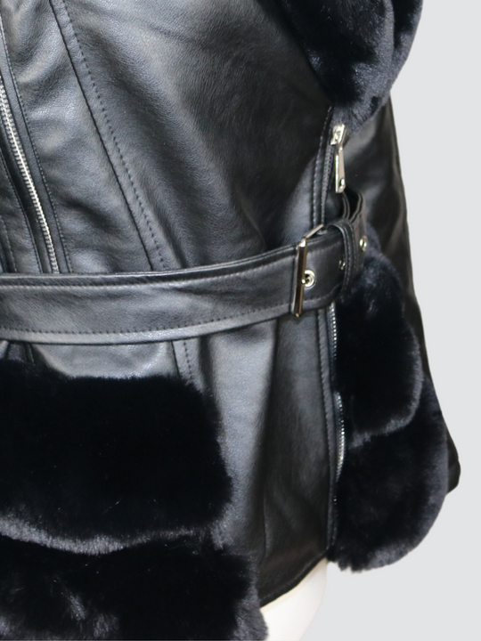 Close up of the bottom part of the jacket, demostrating the bottom faux fur trim and faux leather  belt. 