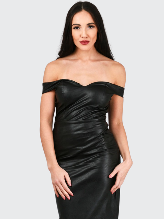 Female model stands in front of a plain background. The model faces the camera and wears a faux leather pu midi dress, with off the shoulder bardot design, sweetheart neckline and zip back design. The model has tanned skin and long black hair, she places both hands on her thighs.
