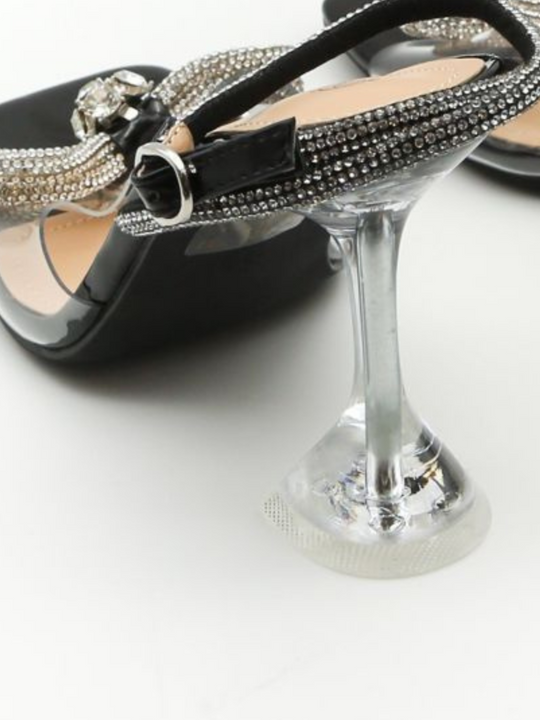 Close up of the sculpt clear heel and the ankle adjustable diamante strap. M