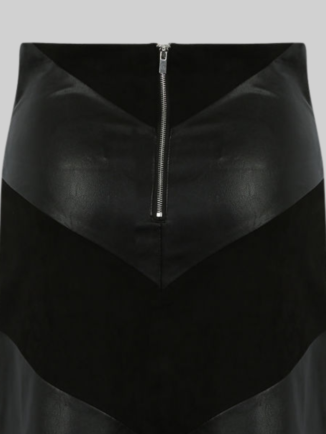 Close up of the faix leather and faux suede panel mini skirt and exposed zip back fastening.