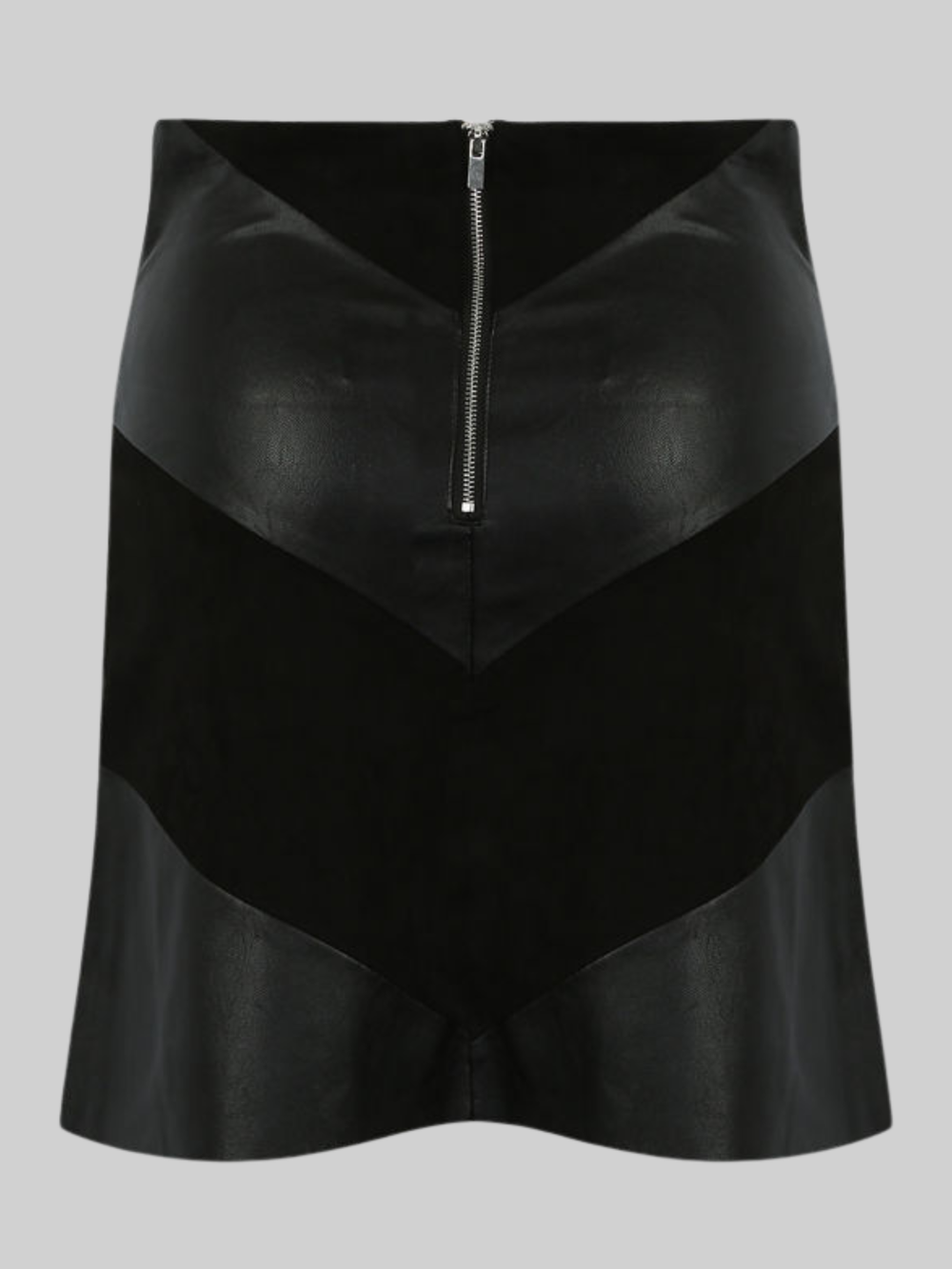 Ghost mannequin wears a black pu fau leather mini skirt, with faxu suede panels. The ghost mannequin stands in front of a plain bakground and stands with his back to the camera, the back of the skirt can be seen, including the faux suede and faux leather panels. The exposed zip back fastening is visible. 