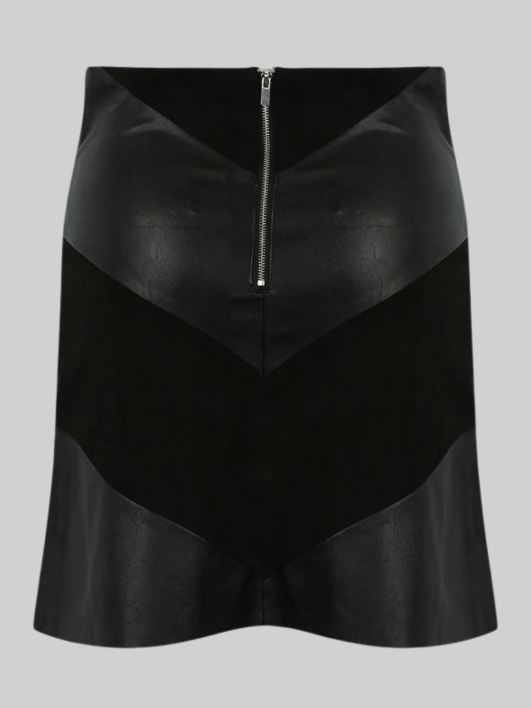 Ghost mannequin wears a black pu fau leather mini skirt, with faxu suede panels. The ghost mannequin stands in front of a plain bakground and stands with his back to the camera, the back of the skirt can be seen, including the faux suede and faux leather panels. The exposed zip back fastening is visible. 