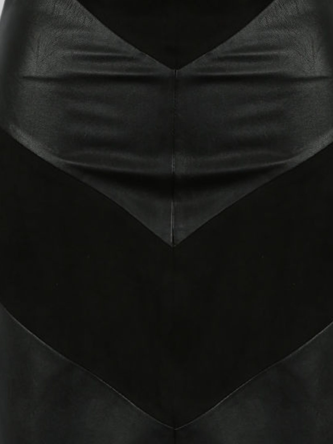 Close up of faux leather and faux sude mini skirt panels. 