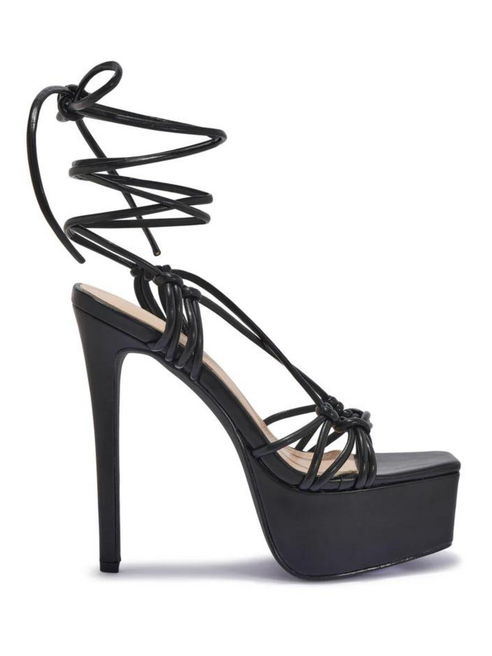 Black shoes with a thick platform base and stiletto heel. The shoe has a strappy thigh lace up design. The side of the shoe can be seen, demonstrating the platform base and high stiletto heel.
