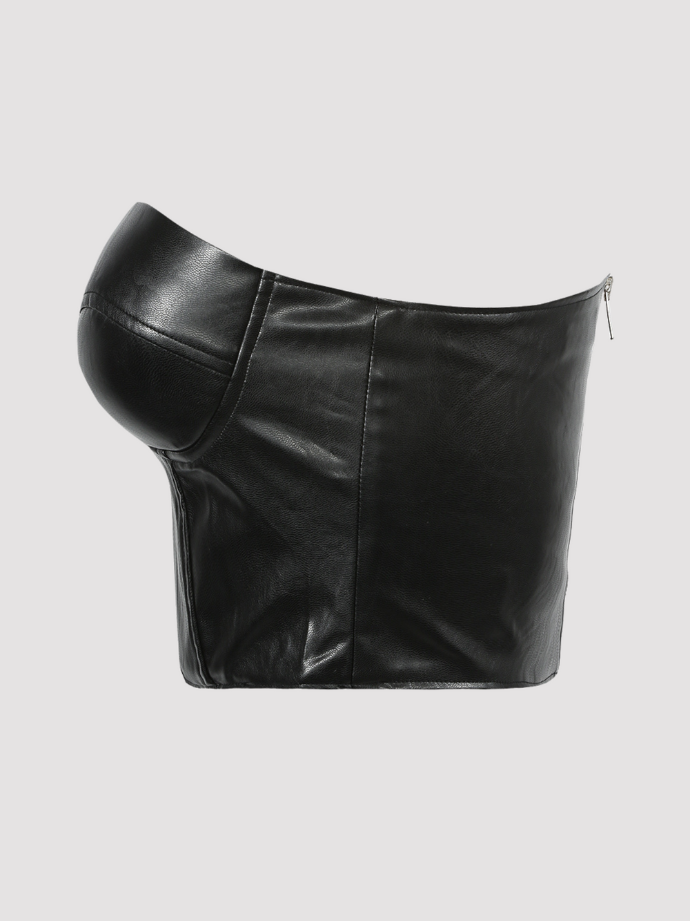 Ghost manequin wears black faux leather bralette crop top, with sweet heart neckline with exposed zip back fastening. Ghost manequin stands to the side, the side of the faux leather top can be seen. 