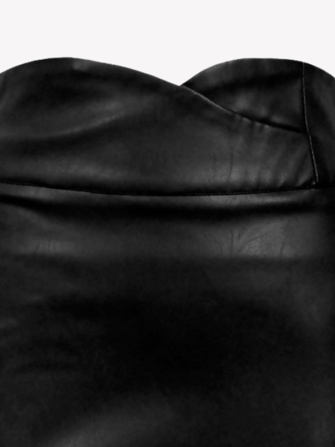 Closeup. Ghost manequin wears  a black pu leather high waisted skirt, with a criss cross sweetheart waist line and zip back  fastening. The picture shows a closeup of the sweetheart style waist band.