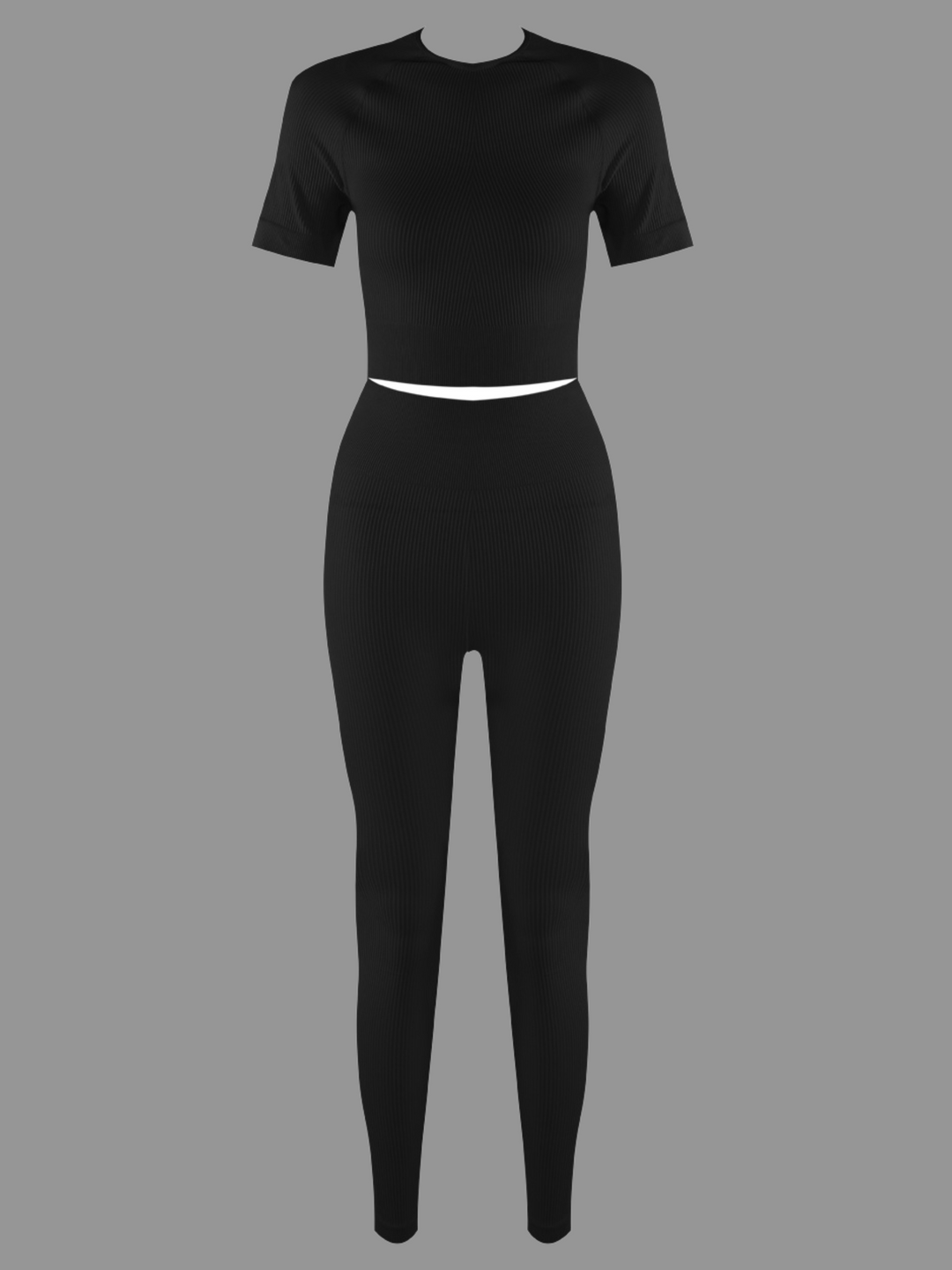 Full length ghost manequin shot. Ghost manequin wears a black ribbed crop top with short sleeves and matching ribbed leggings. The ghost manequin faces forward, the front of the co-ordinated set can be seen. 
