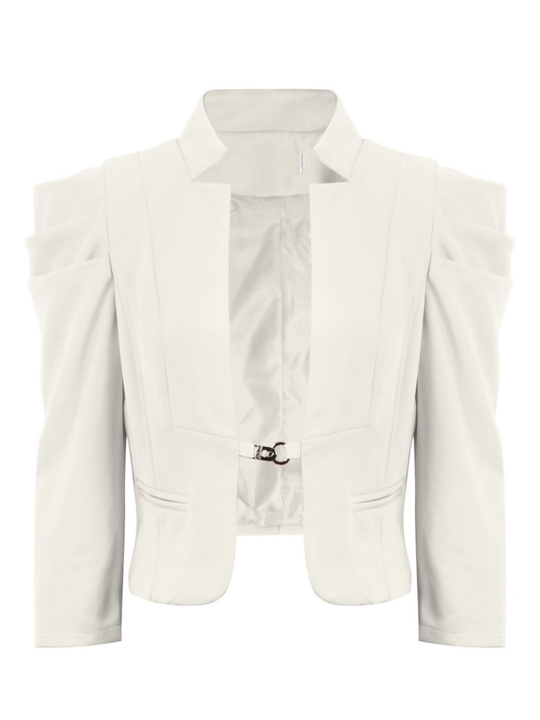 Ghost mannequin stands in front of a plain background, the ghost mannequin wears a cream cropped blazer, with long sleeves and puffed sleeves. The blazer has a front  hook clasp fastening  and faux front side pockets. The ghost mannequin faces forward, the front of the blazer can be seen, including the front hook fastening.