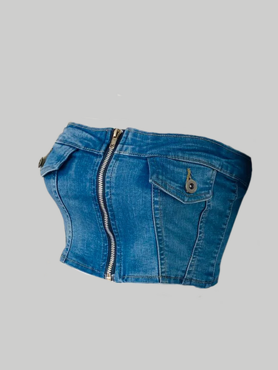 Ghost maneuin wears a denim badeau crop top. The denim top has a silver front zip fastening and front faux pockets. The ghost manequin stands to the side, the side of the denim crop top can be seen, including the faux front pockets. 