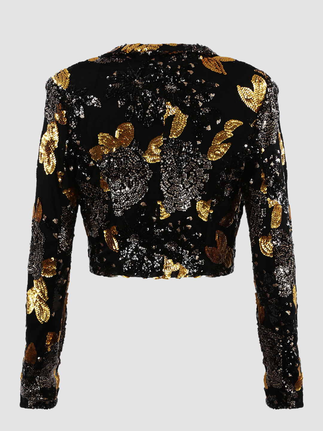 Ghost mannequin stands in front of a plain background. The ghost mennequin wears a black and gold sequinned cropped blazer with open front and long sleeves.The black and gold sequinned blazer has an open front and a luxe design. The ghost mannequin stands with his back to the camera, the back of the blazer can be seen, including the black and gold sequin design. 