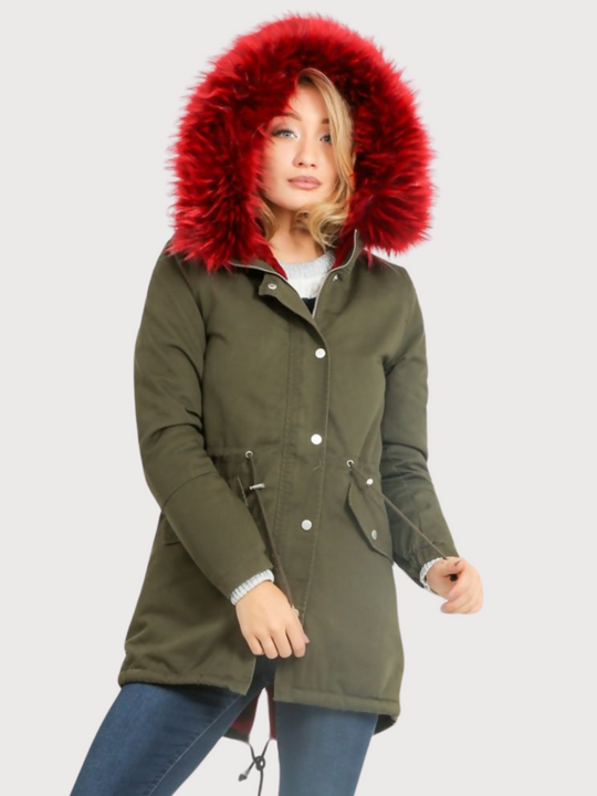 Model wears green khaki parka jacket with  burgandy faux fur hooded trim. The coat has a zip and front button fastening and adjustable string tightening. Model wears the burgandy faux fur  hood and pulls at the adjustable waist string.