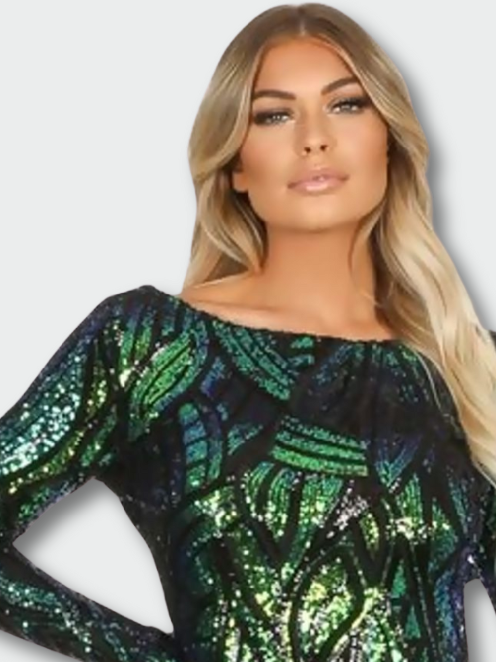 Model wears long sleeved green and black sequined midi dress with open back.  Mid sshot, showing the top of the green and black sequined midi dress. 