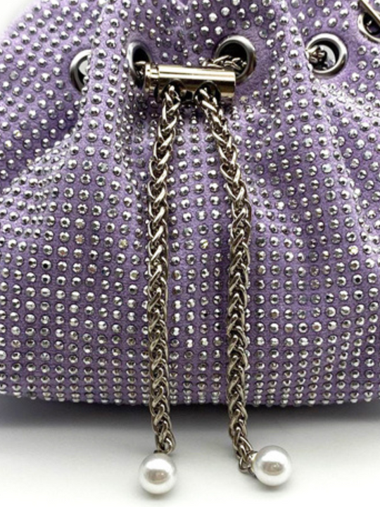 Close up of drawstring silver chain clasp, with lilac materiall and rhinestone studed design. Ther purple silver chain has pearl inserts at the end of the chain. 