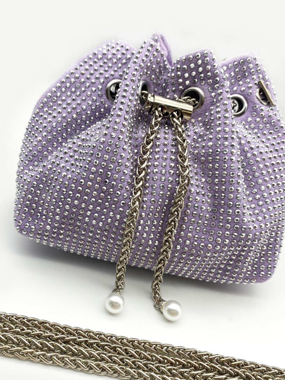 Close up of lilac bag, with studed bag and draw string clasp.  