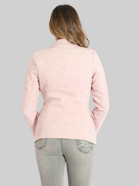 Female model wears a mauve double breatsted blazer with gold military buttons at the front of the blazer and the cuffs. The model has tanned skin and light brown hair, she stands with her back to the camera, the back of the blazer can be seen, showing the structured tailored fit. 
