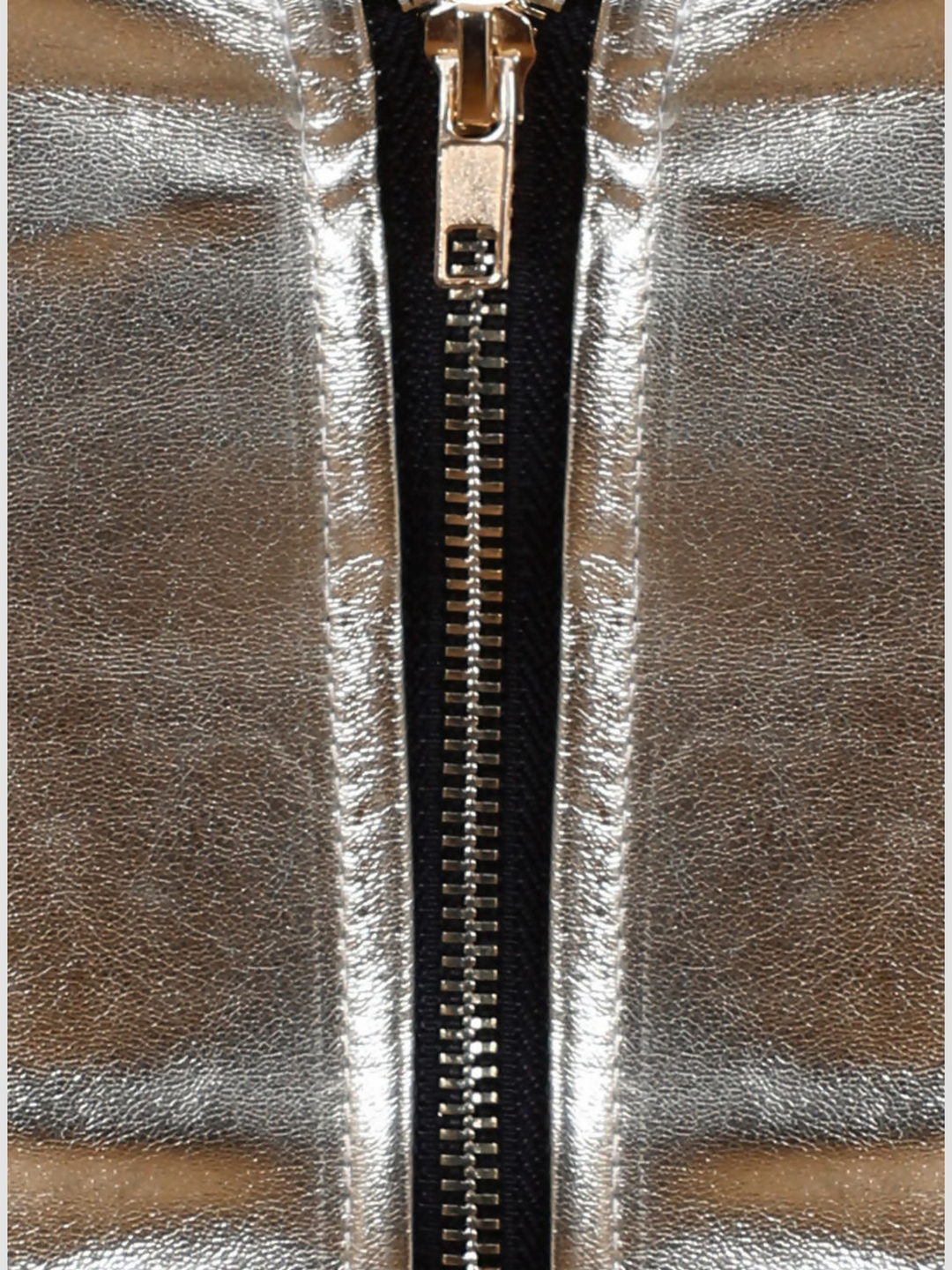 Close up, of exposed zip back fastening.