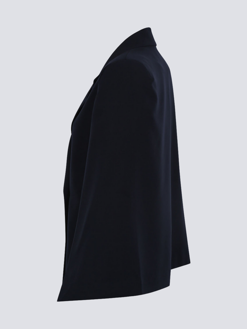 Ghost manequin wears a luxe navy blazeer with a double breasted design, cape sleeves and a gold military buttons at the front of the blazer.  The ghost manequin stands to the side, the side of the blazer can be seen, including the shape of the cape.