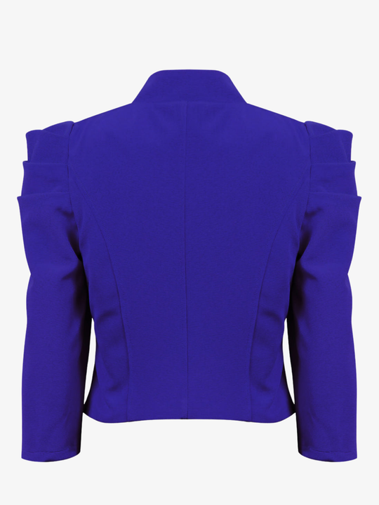 Ghost mannequin stands in front of a plain background, the ghost mannequin wears a royal blue cropped blazer, with long sleeves and puffed sleeves. The blazer has a front  hook clasp fastening  and faux front side pockets. The ghost mannequin faces with his back to the camera, the back of. the blazer can be seen, including the tailored stitching.
