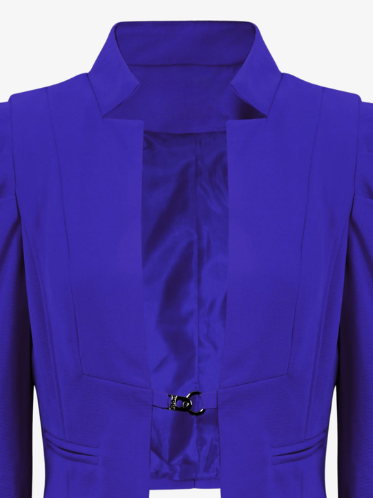 Ghost mannequin stands in front of a plain background, the ghost mannequin wears a royal blue cropped blazer, with long sleeves and puffed sleeves. The blazer has a front  hook clasp fastening  and faux front side pockets. The ghost mannequin faces forward, the hook fastening and interior satin lining can be seen.