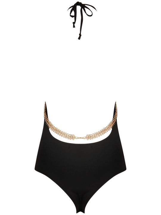 Ghost manequin wears a black slinky bodysuit with a gold chain trim at the front and the rear. The black bodysuit has  a cami front cut and a low back design. The gold chain  can be seen at both the front and the back of the bodysuit.  The ghost manequin faces way from the camera. The halter neck fastening can be seen, as well as the low back and the gold chain that goes across the back and sits above the the low back hem of the bodysuit.  