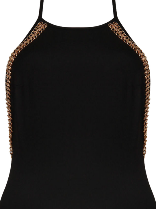 Mid length shot. The ghost manequin faces the camera and the front of the black bodysuit with the gold chain trim can be seen. Ghost manequin wears a black slinky bodysuit with a gold chain trim at the front and the rear. The black bodysuit has  a cami front cut and a low back design. The gold chain  can be seen at both the front and the back of the bodysuit.  